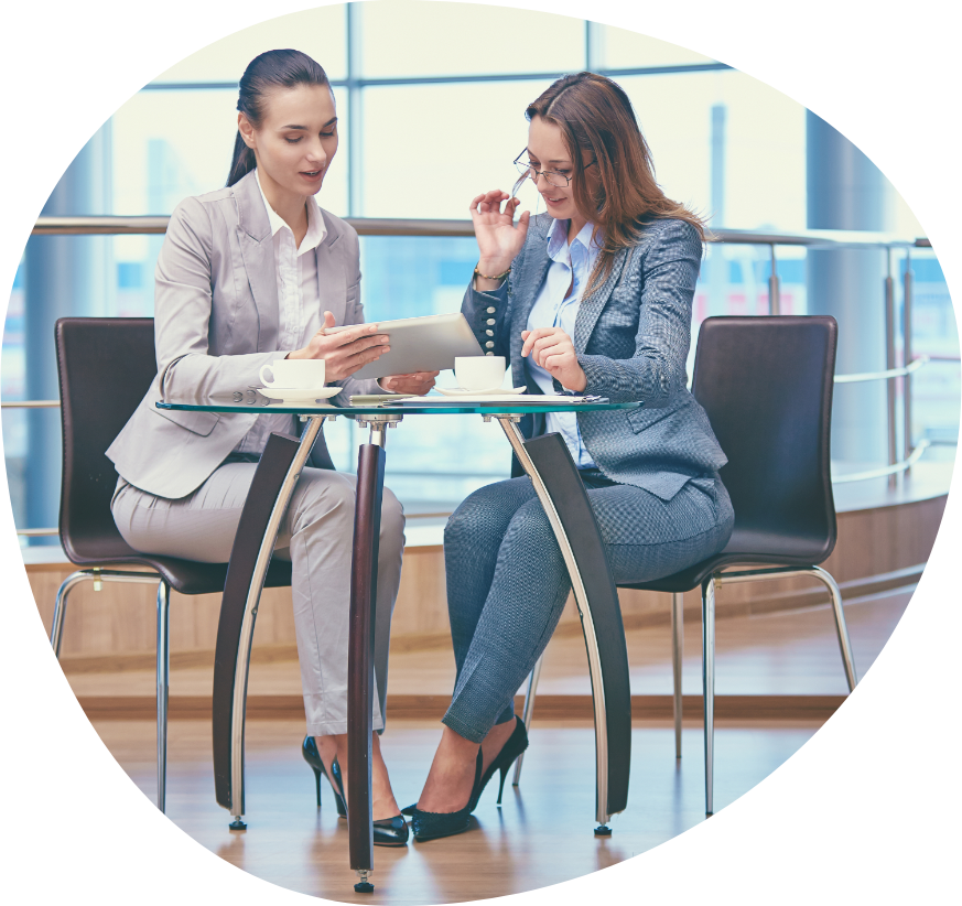 Contact illustration showing two professional women discussing at a table